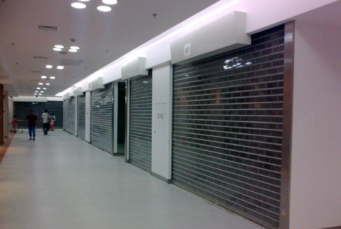 电动车库门和手动门哪个好,车库门用卷帘门好还是不锈钢门好