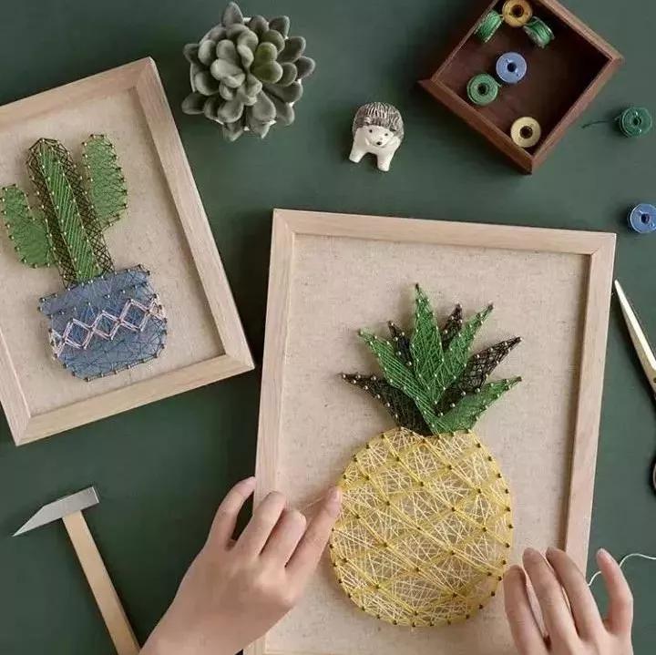 用绳子做绕线画,一根线吊起来拴着笔画画