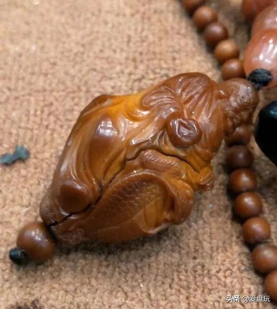 橄榄核雕裂纹怎样补回原样,橄榄核雕竖裂