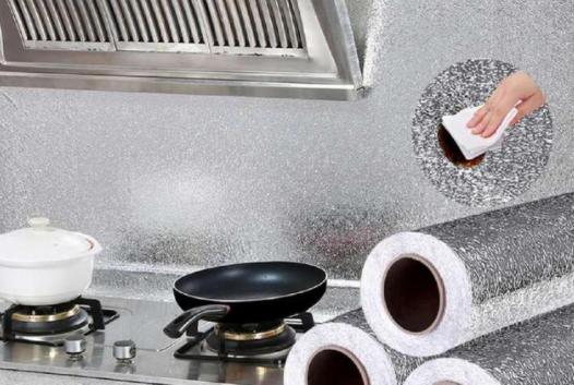 厨房油烟机下面贴油纸,油烟机上面贴纸好清理