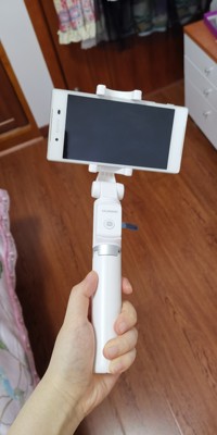 华为三脚架自拍杆af15怎么用,华为有线自拍杆的使用方法及操作