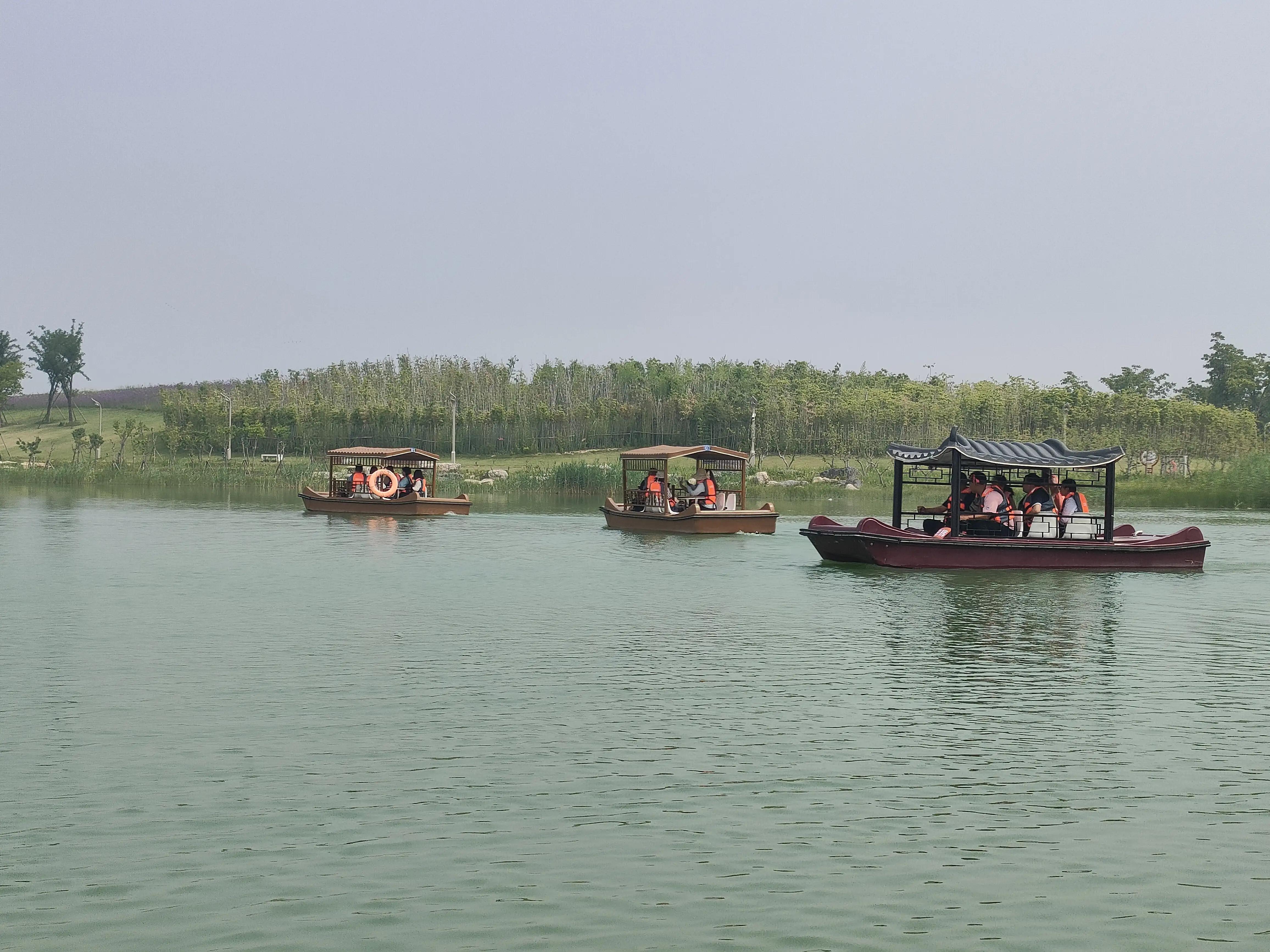 新乡移动长垣分会开展东片区“幸福1+1王家潭划船比赛”活动